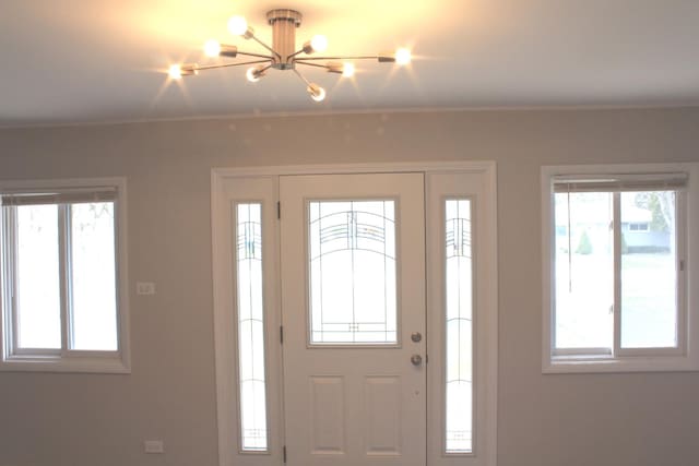 29 S Ash St, Palatine, IL 60067 - entrance foyer featuring a chandelier, plenty of natural light, and crown molding