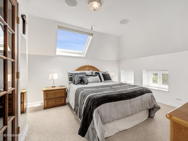 400 Mccarthy Rd Unit 416, Lemont, IL 60439 - bedroom featuring light colored carpet, a skylight, and vaulted ceiling