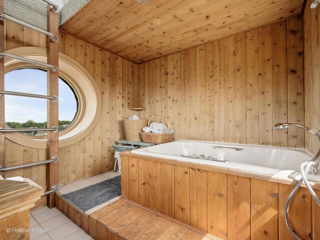 400 Mccarthy Rd Unit 416, Lemont, IL 60439 - bathroom with a garden tub, wooden walls, tile patterned flooring, and wooden ceiling
