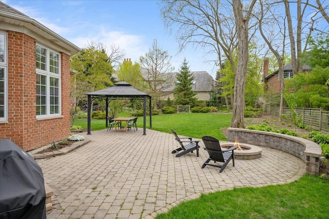 view of patio / terrace featuring a fire pit, a gazebo, and area for grilling