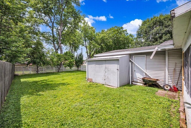 1216 N Oak St, Bloomington, IL 61701 - fenced backyard with a storage unit