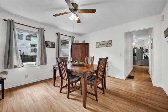 1216 N Oak St, Bloomington, IL 61701 - dining space featuring a ceiling fan and light wood-style flooring