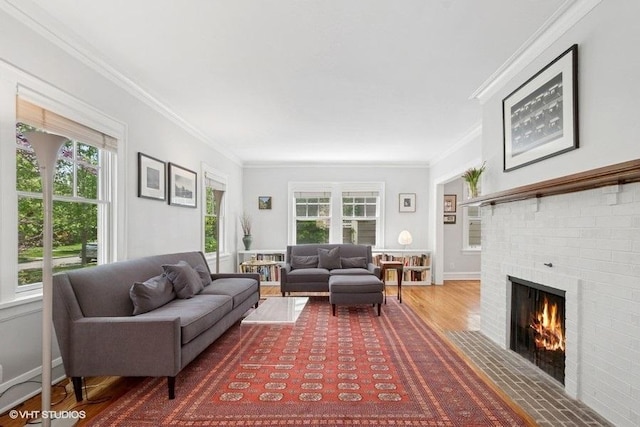 2206 Forestview Rd, Evanston, IL 60201 - living room with plenty of natural light, a brick fireplace, wood finished floors, ornamental molding, and baseboards