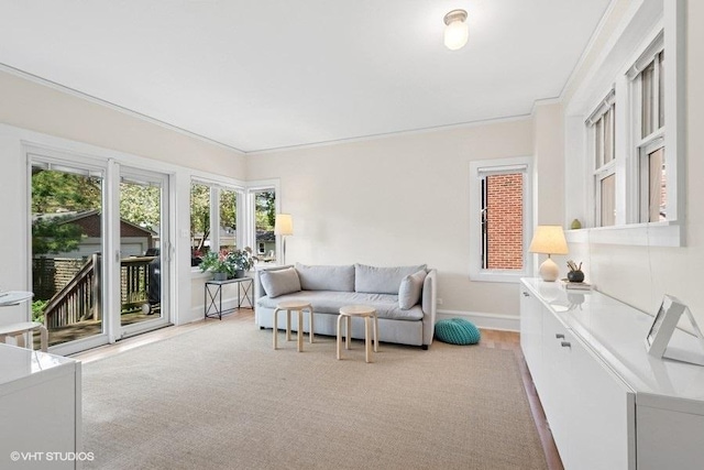 2206 Forestview Rd, Evanston, IL 60201 - living area with baseboards, ornamental molding, and light wood-style floors