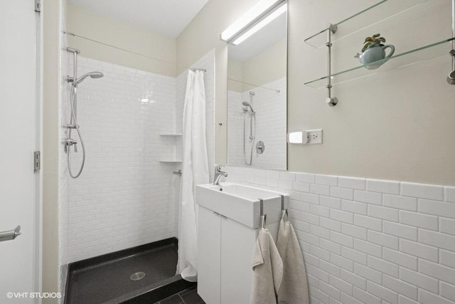 2206 Forestview Rd, Evanston, IL 60201 - full bath with a shower stall, vanity, tile walls, and wainscoting