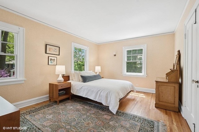 2206 Forestview Rd, Evanston, IL 60201 - bedroom featuring wood finished floors, baseboards, and crown molding