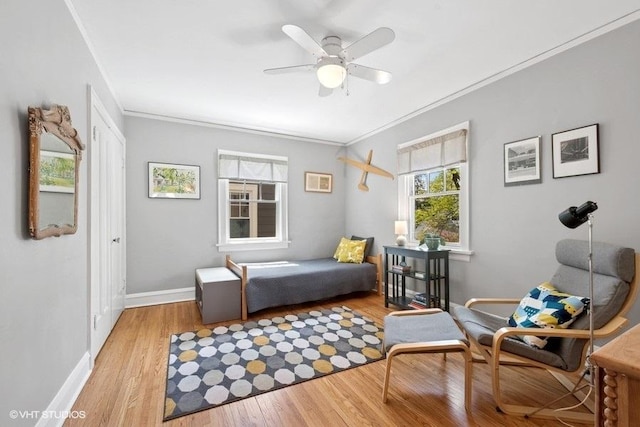 2206 Forestview Rd, Evanston, IL 60201 - bedroom with wood finished floors, baseboards, crown molding, a closet, and a ceiling fan