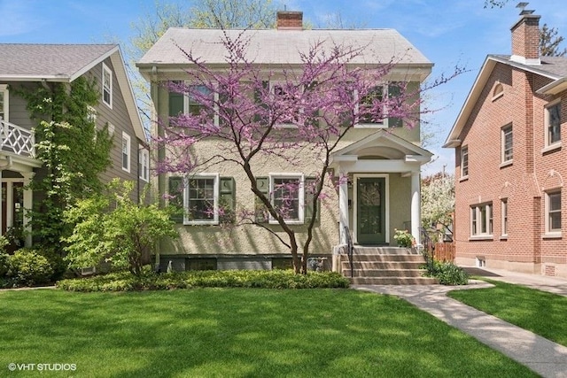 2206 Forestview Rd, Evanston, IL 60201 - view of front facade featuring a front lawn and a chimney