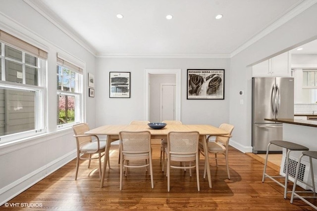 2206 Forestview Rd, Evanston, IL 60201 - dining space featuring crown molding, wood finished floors, baseboards, and recessed lighting