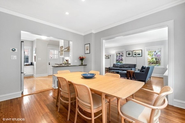 2206 Forestview Rd, Evanston, IL 60201 - dining space featuring light wood-style floors, ornamental molding, baseboards, and recessed lighting