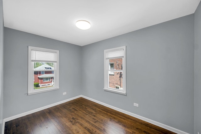 1513 Euclid Ave, Chicago Heights, IL 60411 - unfurnished room with baseboards and dark wood-style flooring