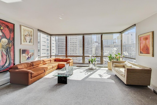 carpeted living area featuring a view of city, a baseboard radiator, and expansive windows