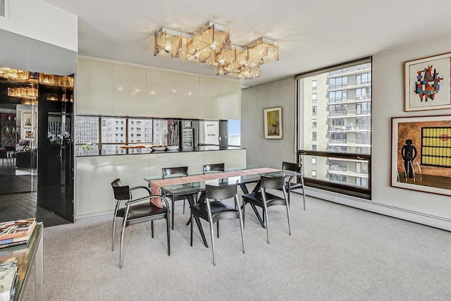 dining room featuring carpet flooring and baseboard heating
