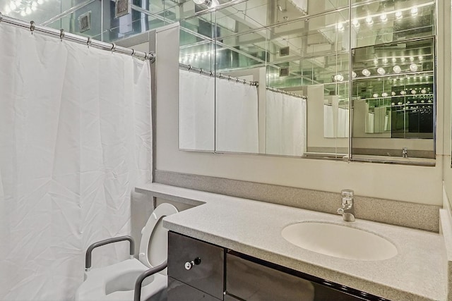 full bath featuring vanity and curtained shower