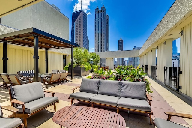 view of patio / terrace featuring an outdoor living space and a skyline view