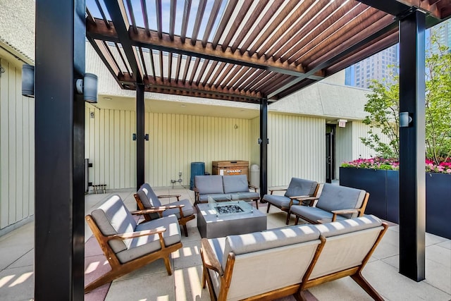 view of patio / terrace with an outdoor living space with a fire pit and a pergola