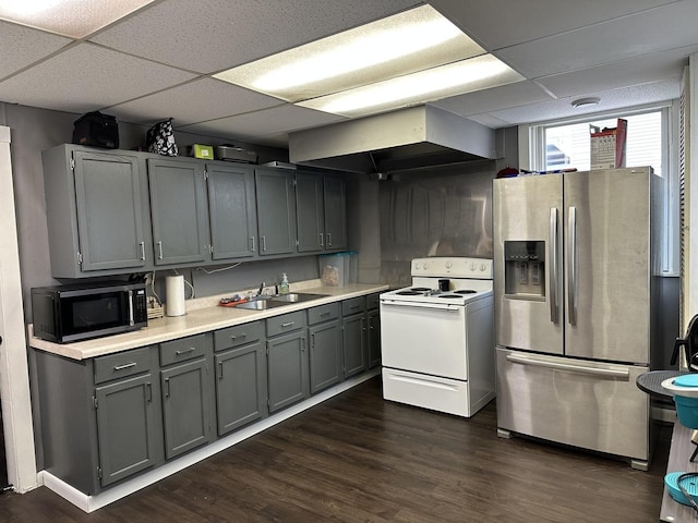 kitchen featuring stainless steel fridge with ice dispenser, electric range, black microwave, a sink, and wall chimney exhaust hood