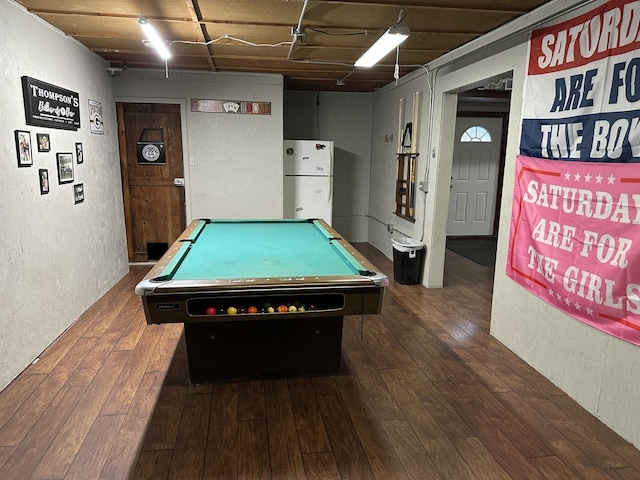 playroom featuring hardwood / wood-style flooring, pool table, and a textured wall