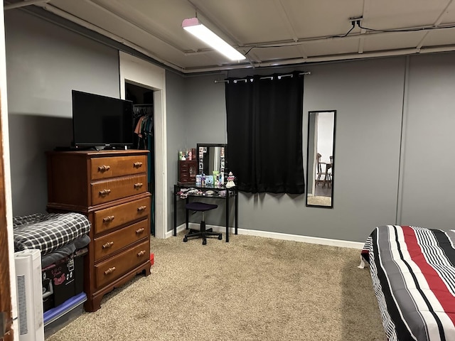 bedroom with carpet and baseboards