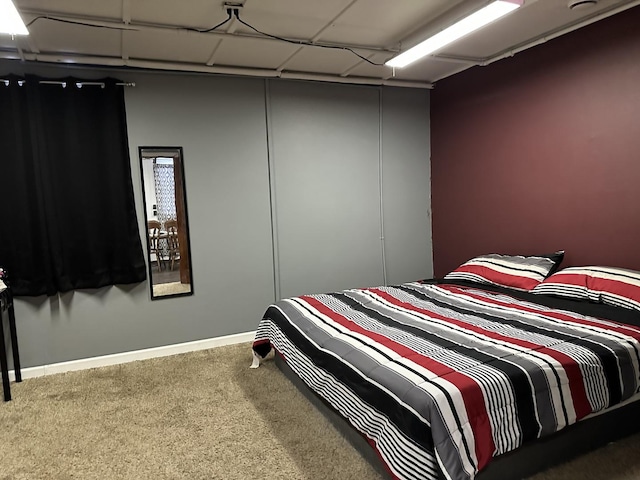carpeted bedroom with baseboards