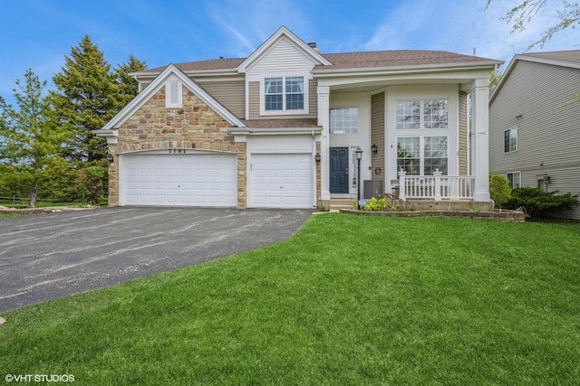 7181 Dada Dr, Gurnee, IL 60031 - view of front of property with driveway, a front yard, and stone siding