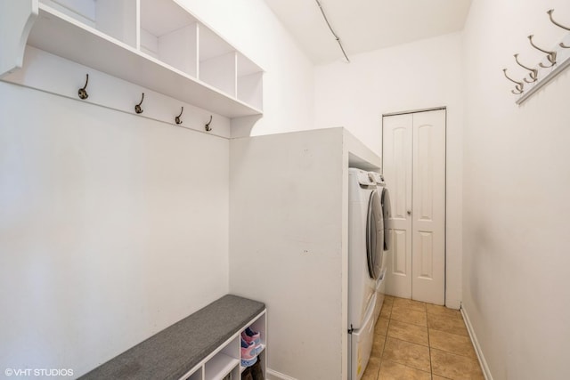 7181 Dada Dr, Gurnee, IL 60031 - washroom featuring baseboards, light tile patterned flooring, and washing machine and clothes dryer