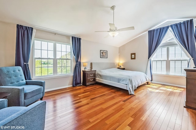 7181 Dada Dr, Gurnee, IL 60031 - bedroom featuring wood finished floors, lofted ceiling, baseboards, and a ceiling fan