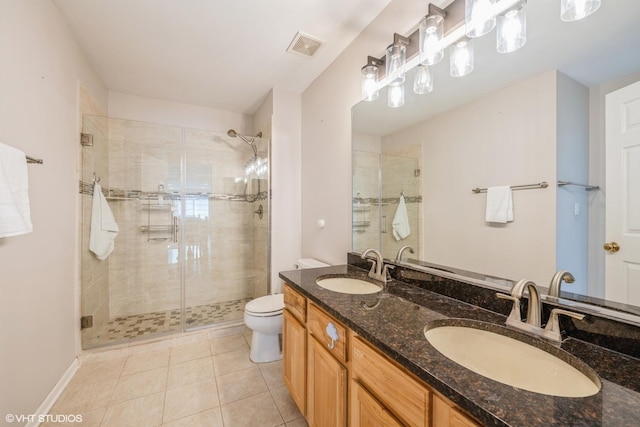 7181 Dada Dr, Gurnee, IL 60031 - bathroom with toilet, a stall shower, double vanity, and tile patterned floors