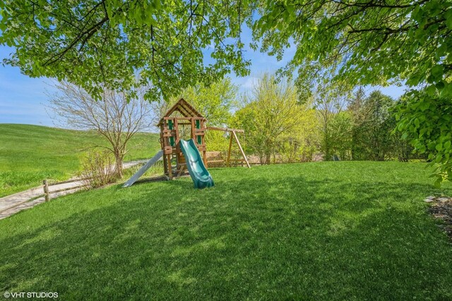 7181 Dada Dr, Gurnee, IL 60031 - view of green lawn featuring a playground