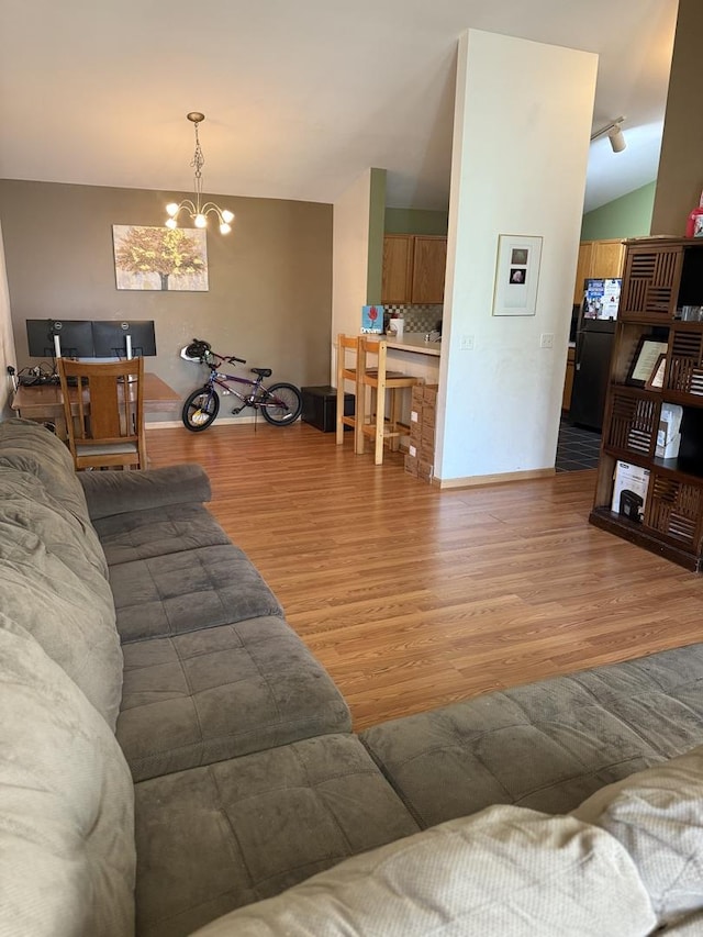 1646 Mcclure Rd Unit 1646, Aurora, IL 60505 - living room featuring light wood-style flooring and a chandelier