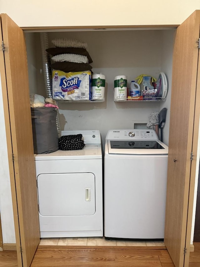 1646 Mcclure Rd Unit 1646, Aurora, IL 60505 - clothes washing area featuring washing machine and clothes dryer and light wood-style floors