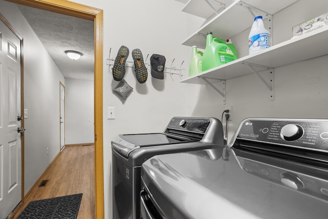 8 Harrison Ct, Bloomington, IL 61704 - laundry room featuring washer and dryer and light wood-style flooring