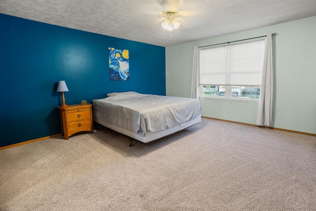 8 Harrison Ct, Bloomington, IL 61704 - bedroom with carpet flooring, baseboards, a textured ceiling, and a ceiling fan