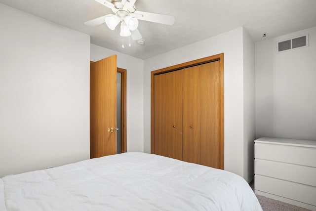 8 Harrison Ct, Bloomington, IL 61704 - carpeted bedroom featuring a closet and ceiling fan