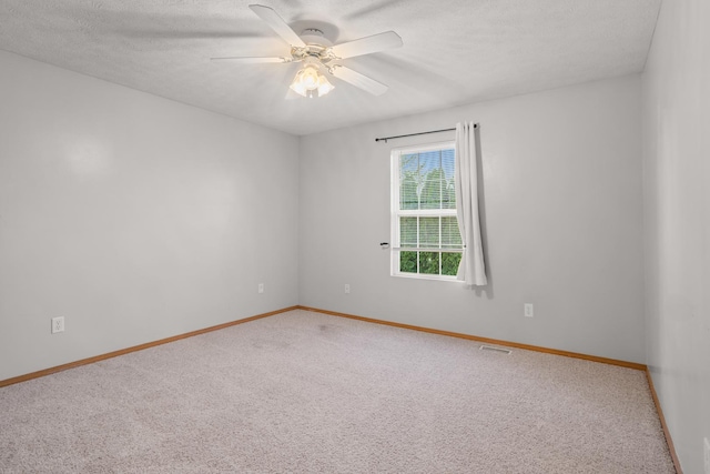 8 Harrison Ct, Bloomington, IL 61704 - empty room featuring carpet, ceiling fan, baseboards, and a textured ceiling