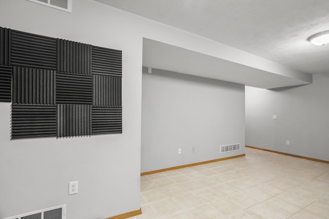 8 Harrison Ct, Bloomington, IL 61704 - unfurnished room with a textured ceiling and baseboards