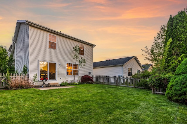 8 Harrison Ct, Bloomington, IL 61704 - back of property at dusk featuring a patio area