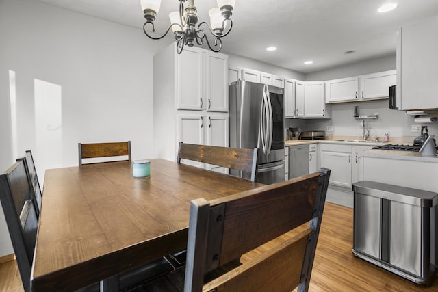 8 Harrison Ct, Bloomington, IL 61704 - kitchen featuring smart refrigerator, a sink, a chandelier, light countertops, and recessed lighting