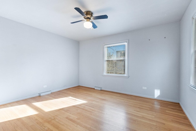 12217 S 68th Ct, Palos Heights, IL 60463 - spare room featuring light wood-style flooring, baseboards, and a ceiling fan