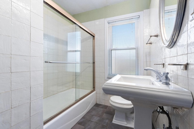 12217 S 68th Ct, Palos Heights, IL 60463 - bathroom with tile walls, combined bath / shower with glass door, toilet, and tile patterned flooring
