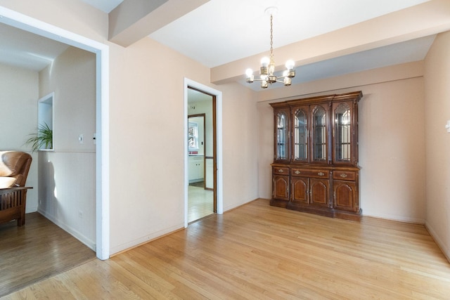 12217 S 68th Ct, Palos Heights, IL 60463 - dining space with a chandelier, light wood-style floors, and baseboards