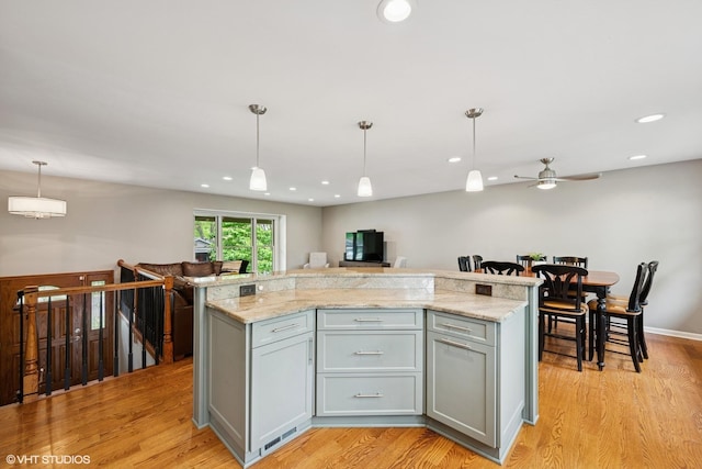 153 E Timberlane Dr, Palatine, IL 60067 - kitchen featuring gray cabinetry, open floor plan, light wood finished floors, a ceiling fan, and recessed lighting