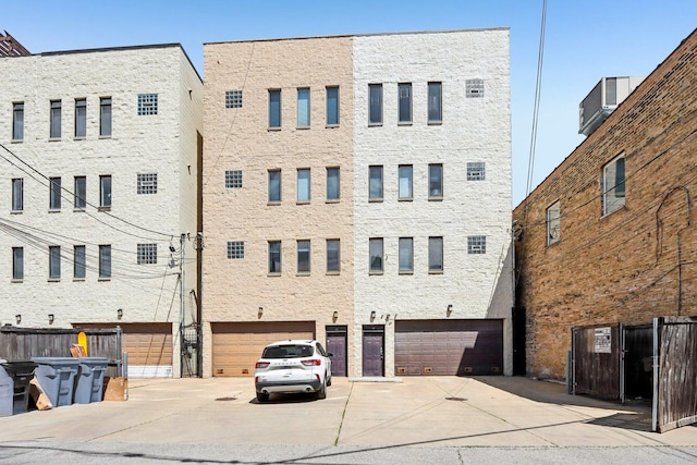 view of property featuring driveway and an attached garage