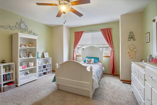 bedroom with carpet flooring and a ceiling fan