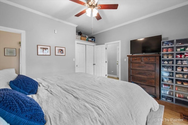 2447 W Walton St Unit 1, Chicago, IL 60622 - bedroom featuring ornamental molding, wood finished floors, a ceiling fan, and a closet