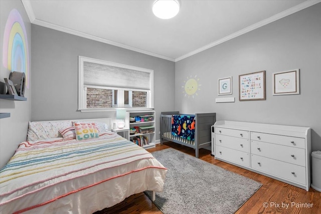 2447 W Walton St Unit 1, Chicago, IL 60622 - bedroom featuring ornamental molding and wood finished floors