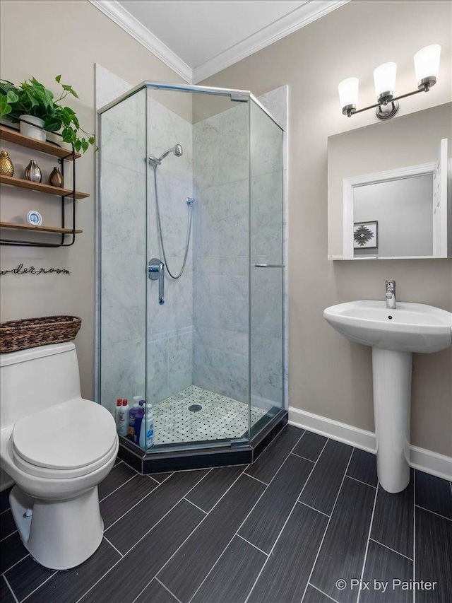 2447 W Walton St Unit 1, Chicago, IL 60622 - full bath with ornamental molding, toilet, a stall shower, baseboards, and wood finish floors