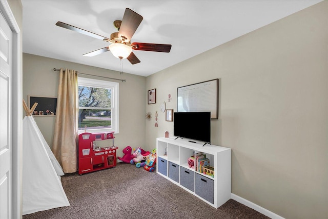 game room with carpet floors and a ceiling fan
