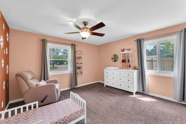 bedroom with multiple windows, carpet floors, baseboards, and ceiling fan