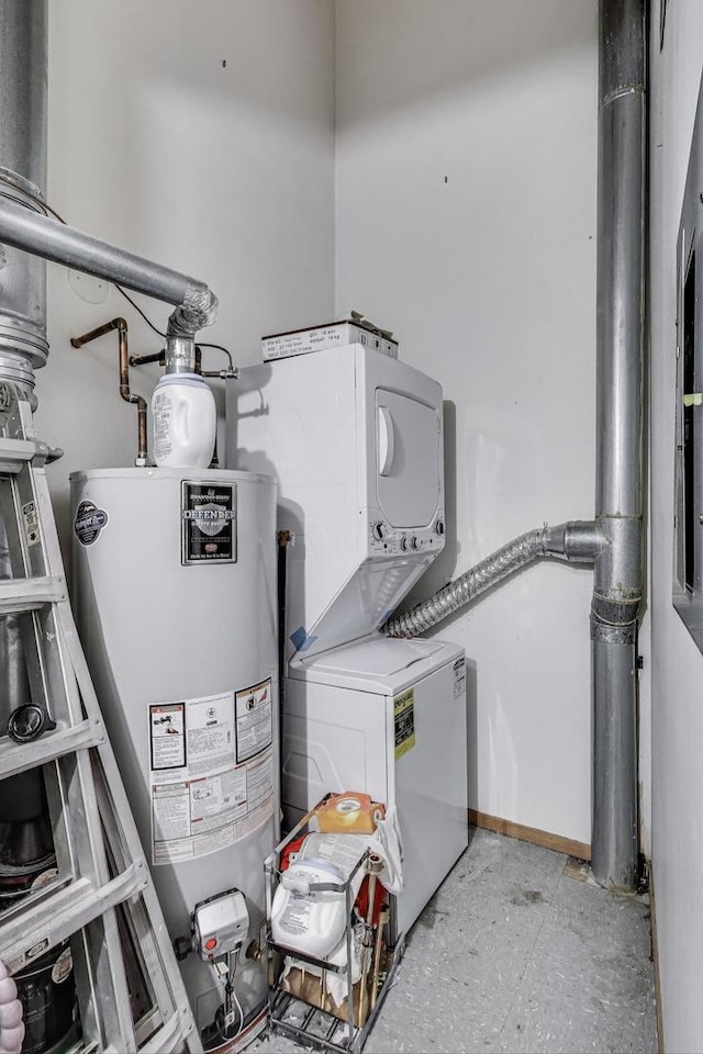 clothes washing area with estacked washer and dryer and water heater